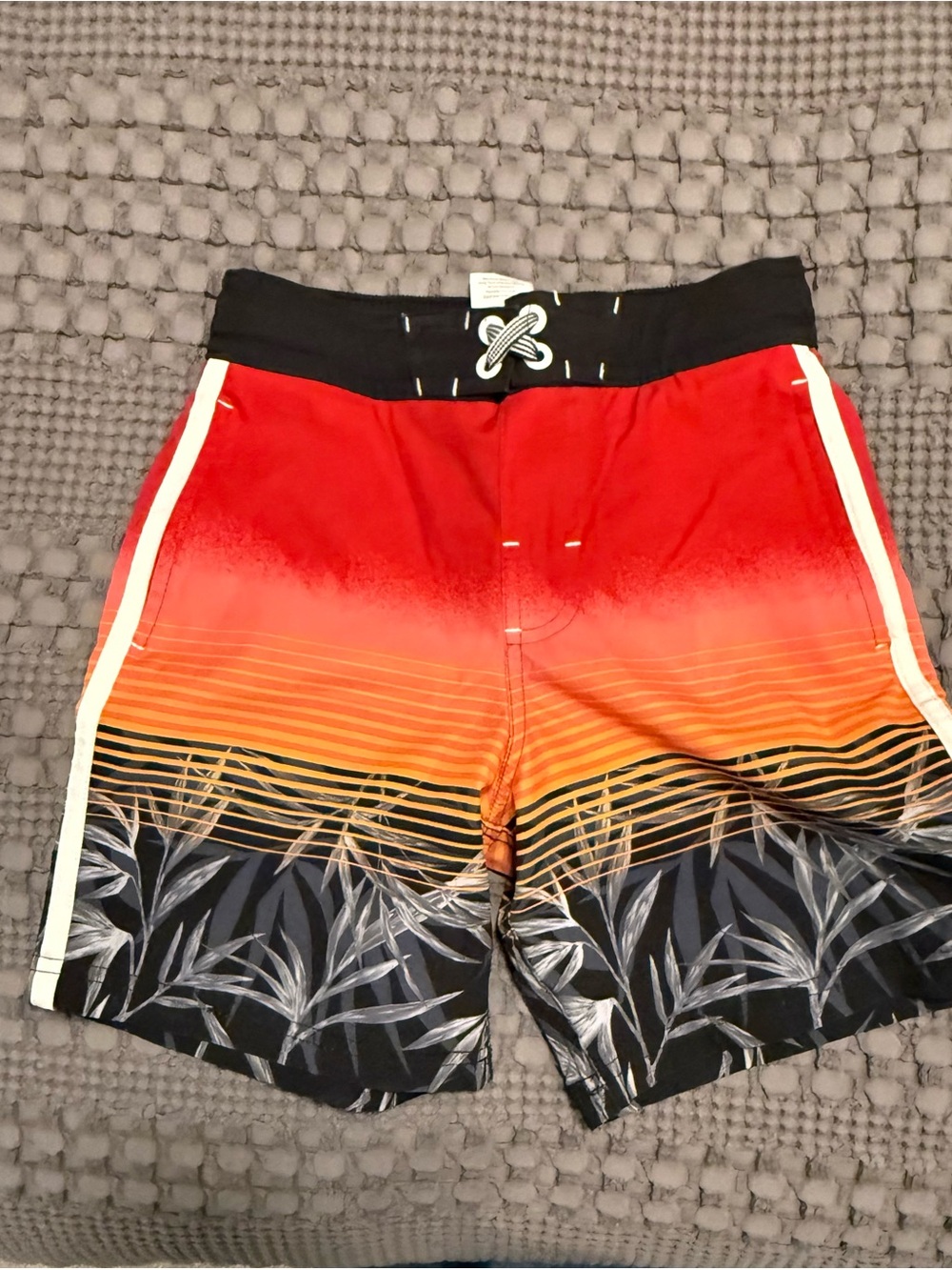 Kid’s Red Orange Gradient Swim Trunks with Tropical Print